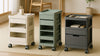 Editorial photo comparing three rolling storage carts with tiered trays in a modern living room, highlighting construction, materials, and caster placement.