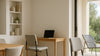 Editorial interior scene showing coordinated dining, desk, outdoor, and auxiliary chair options in one unified, photorealistic space.